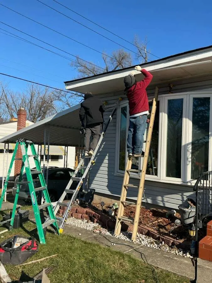 Restoration crew performing exterior repair in Elma